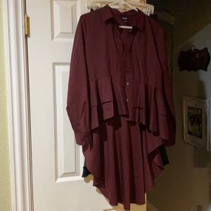 Fashionable high low blouse. Deep burgundy in color.